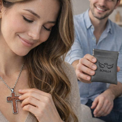 Woman holding a necklace with a man holding a gray pouch with 'Bonilla' branding in the background.