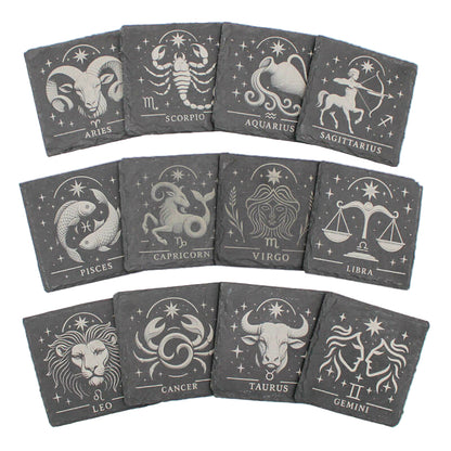 Set of twelve zodiac coasters on a white background