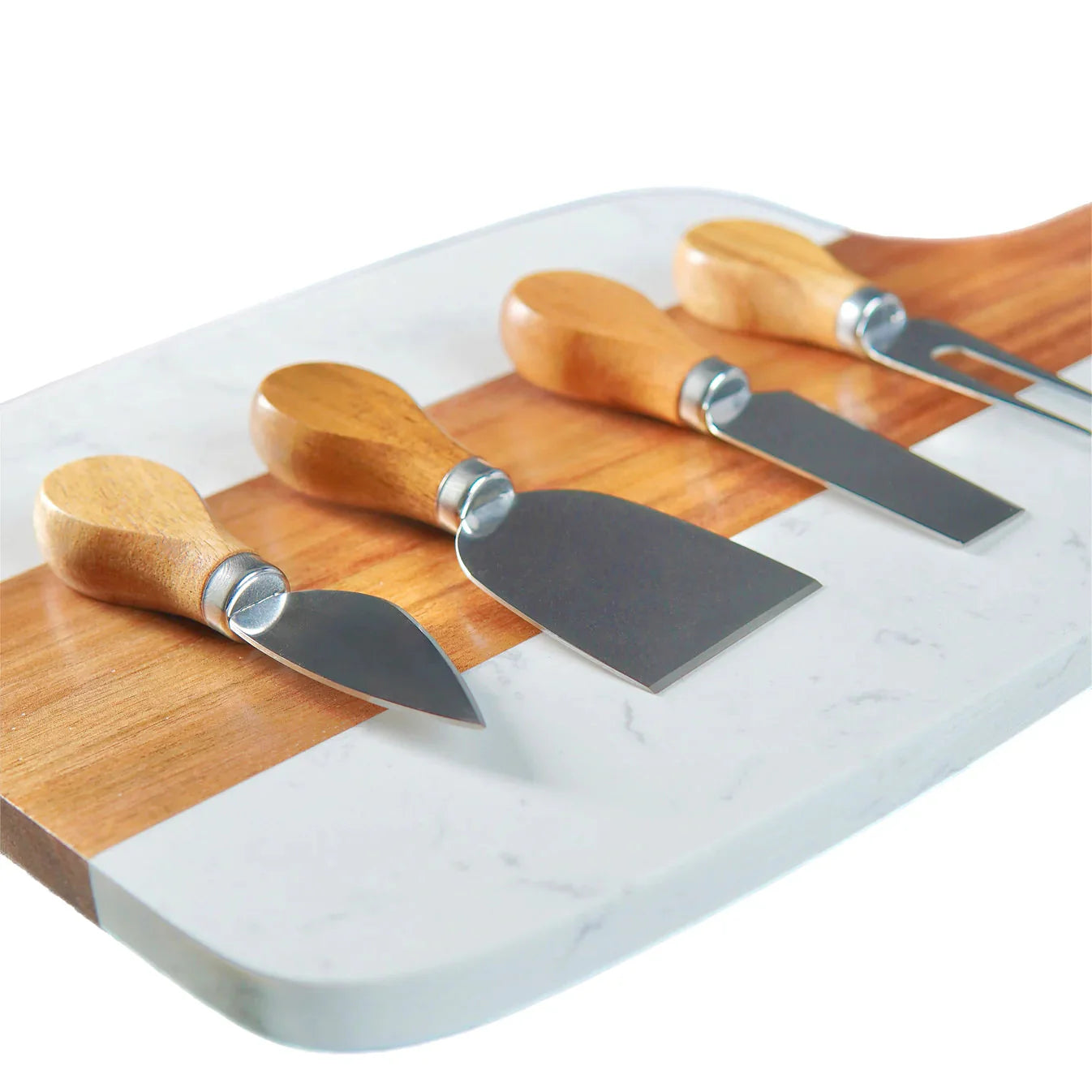 Set of four cheese knives with wooden handles on a marble cutting board.