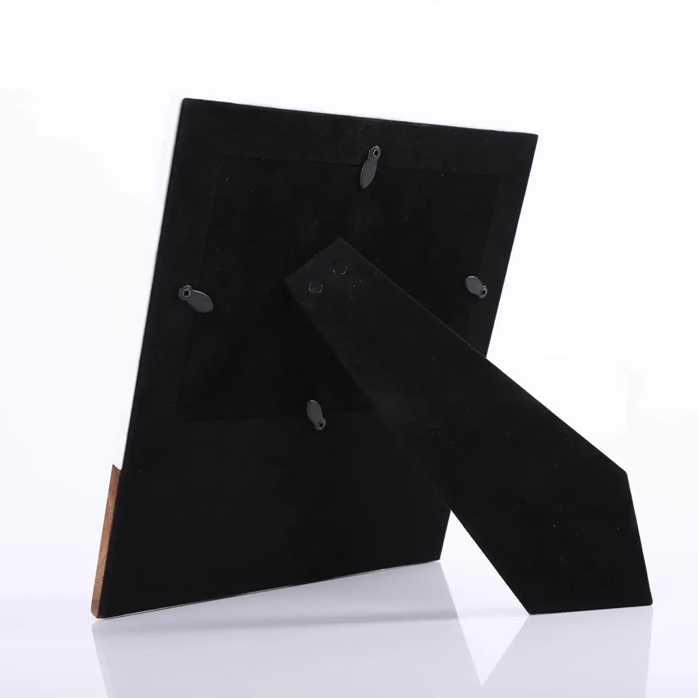 Back view of a black marble and wood tabletop picture frame with adjustable stand for photo display