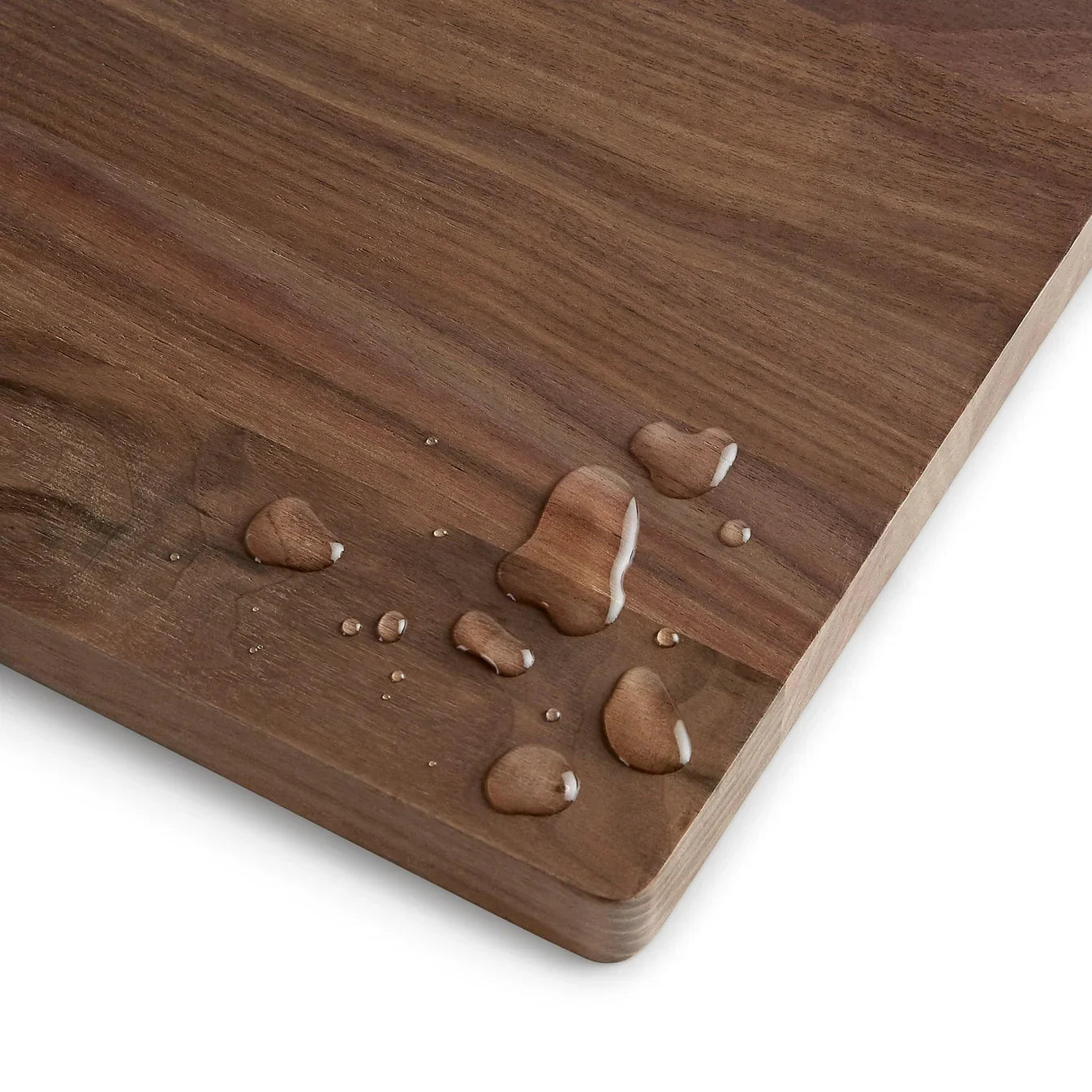 Wooden cutting board with water droplets 